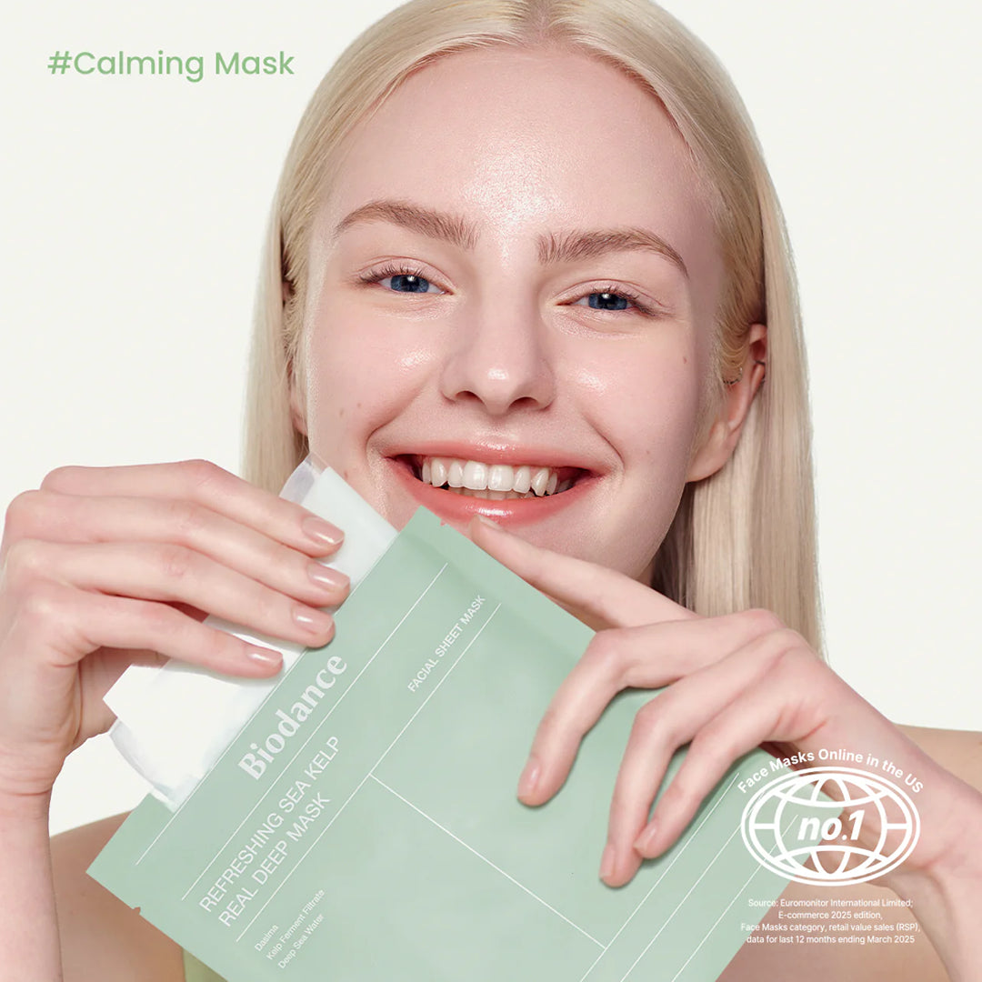 Woman holding a Biodance sheet mask with a white background