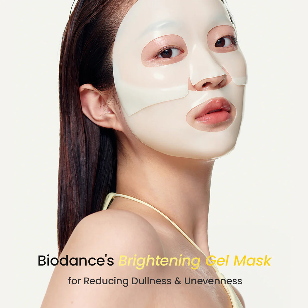 Woman wearing a Biodance brightening gel mask on a white background