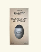Teazen Kombucha Reusable Cup packaging box for cold tea, showing a silver-gray cup through a die-cut window on a beige background.