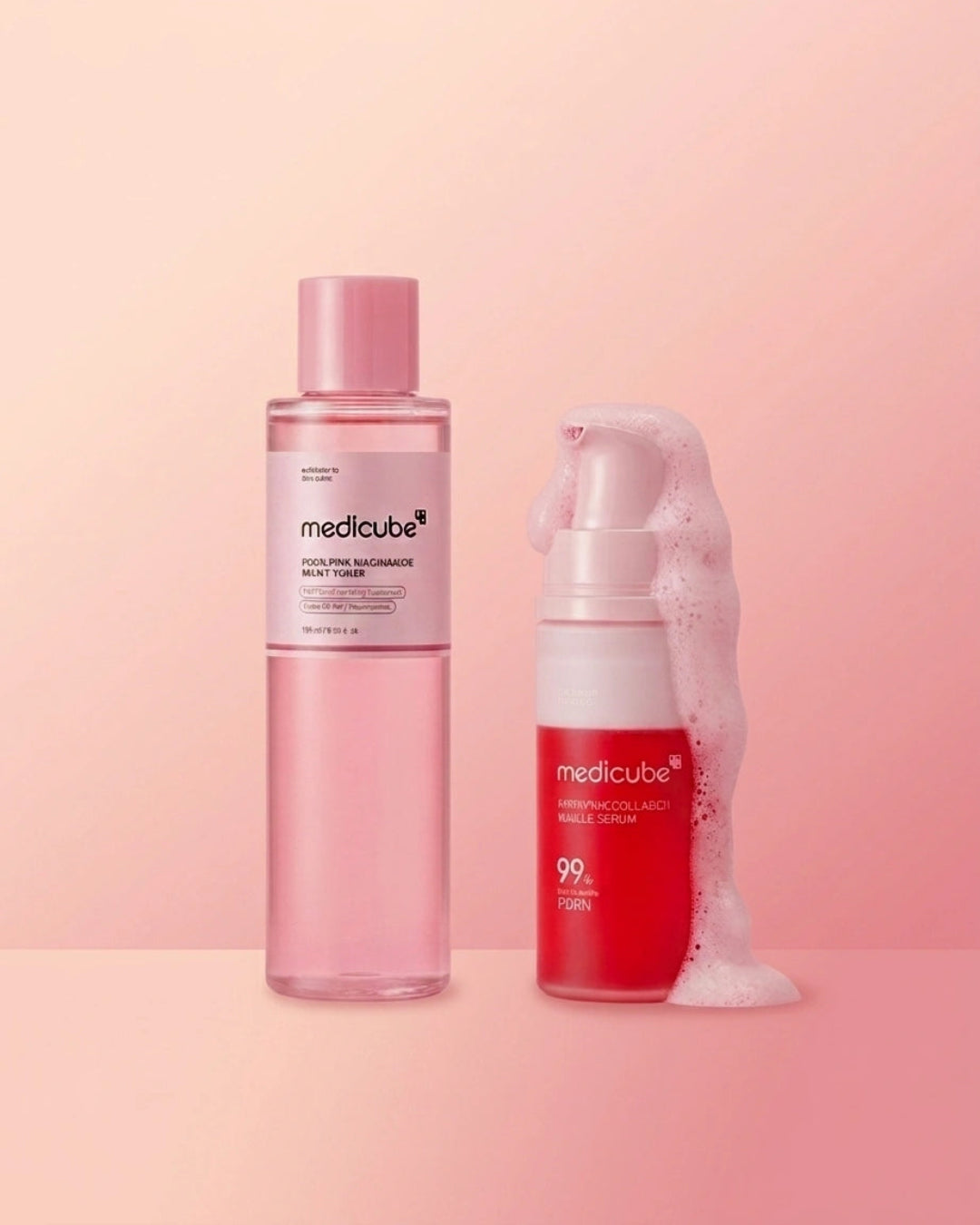 Two Medik8 skincare bottles on a soft pink studio background: a tall translucent pink bottle labeled 'Medik8 Clearing Supercharged Moisturizer' and a red-and-white pump bottle labeled 'Medik8 Red' with white foam around it.
