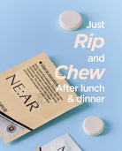 A flat-lay product shot of a NE:AR chew packet on a light blue background, with two white round tablets placed nearby and large overlaid text reading 'Just Rip and Chew After lunch & dinner.' This is not a person-in-environment lifestyle scene and not an instruction diagram; it is a clean commercial product presentation, so subject_type is Product/Packaging.