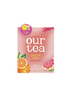 A package of Our Tea Fruit Black Tea in grapefruit and orange flavor, featuring a pink box with illustrations of a grapefruit slice, an orange slice, and green leaves, on a white background.