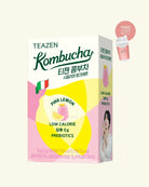 A box of Teazen Kombucha Pink Lemon flavor, featuring a pink and yellow design with a small Italian flag graphic, a 'FREE PLANTY BERRY CUPS' promotional badge, and a small photo of a woman on the side panel, all set against a solid cream background.