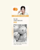 A vertical skincare product card on a pale cream background. The card features a model in the top right, orange fruit illustrations at the top left, Korean text including '국글 국글 국글기' and '국글 국글 국글기', and a black-and-white photo of grapefruits in the lower half.