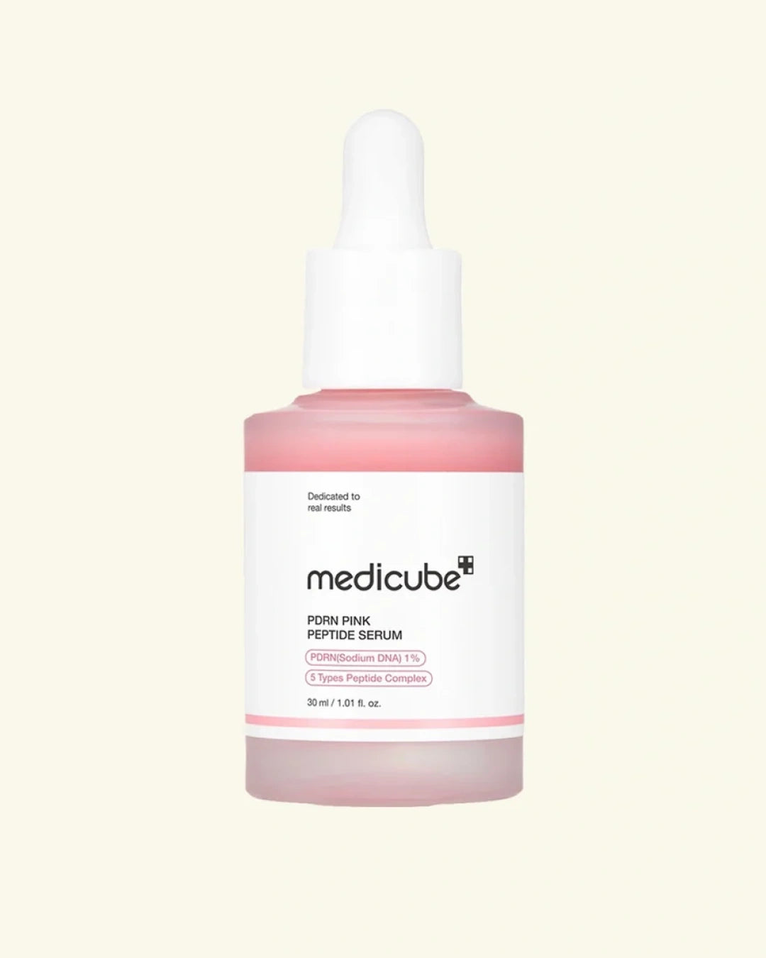 Medicube Poin Pink Peptide Serum in a frosted glass dropper bottle with a pink liquid and a white label, set against a solid pale cream background.
